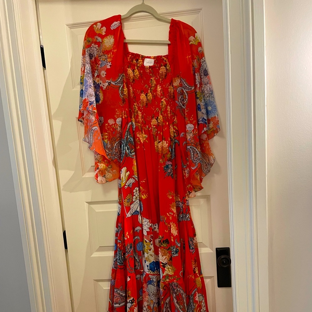 Camilla long silk dress with rhinestone detailing on sleeves.